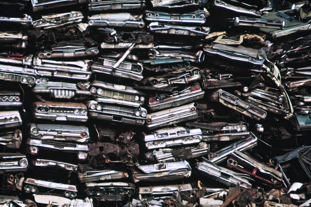 a pile of old cars sitting next to each other | The National Recycling Corporation