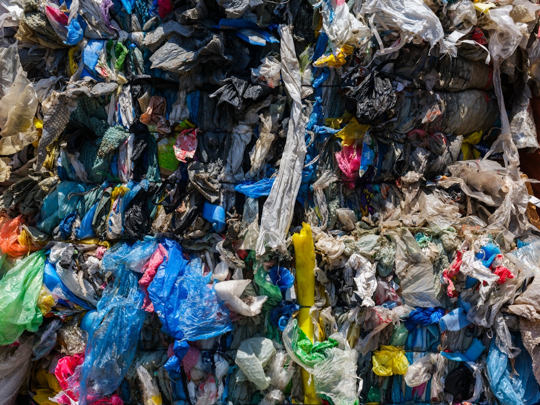 A large pile of trash sitting on top of a street | The National Recycling Corporation